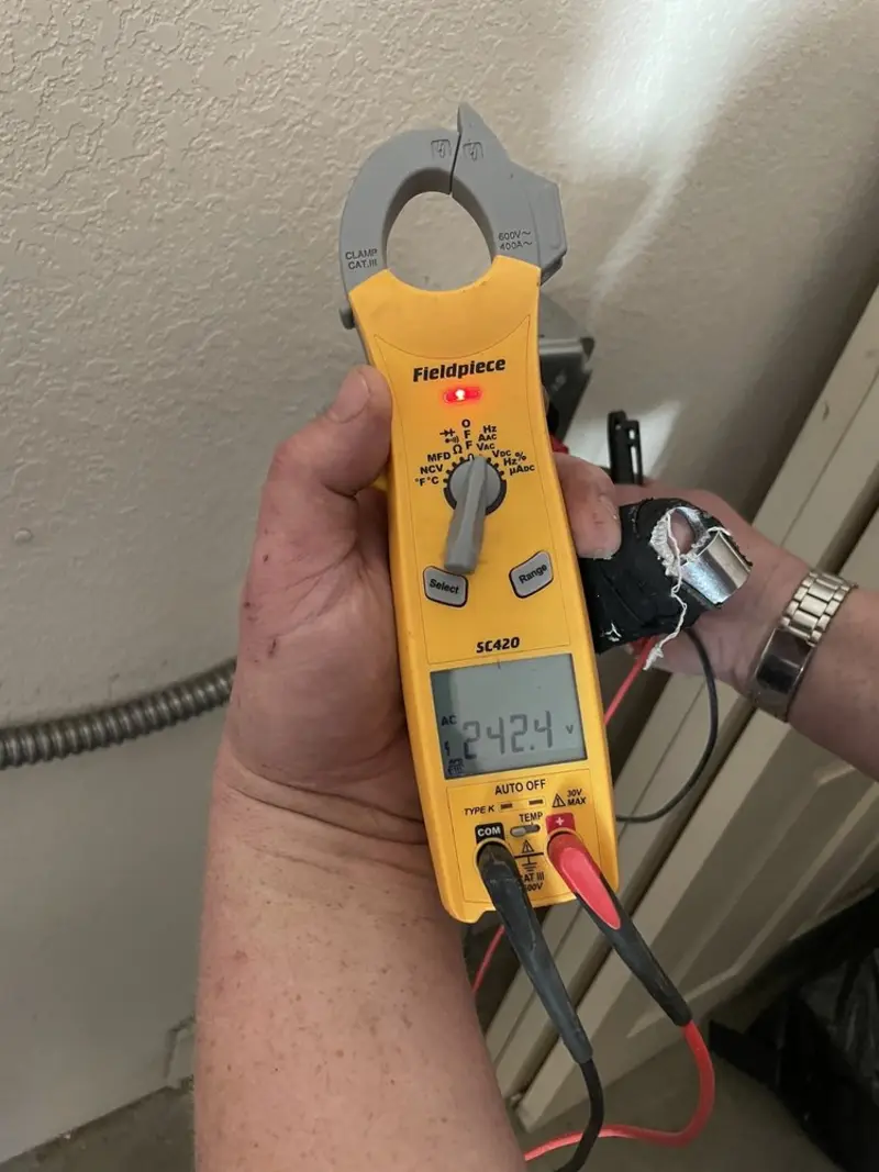 Voltage testing with clamp meter during Electrical Installation Services in Port Huron